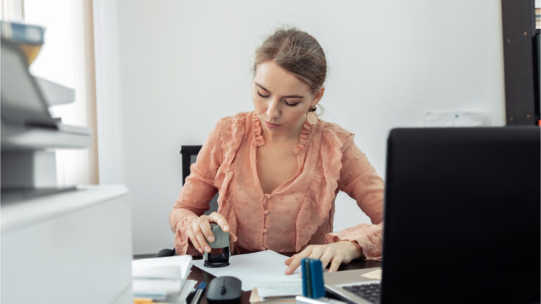 Businesswoman stamps approval